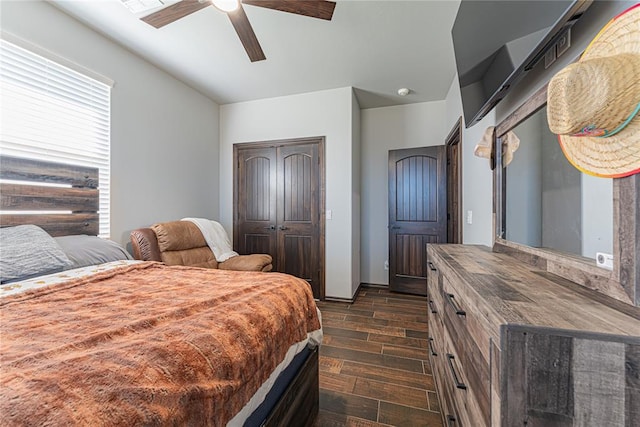 2063 County Road 1336, Blanchard, OK 73010 - bedroom with dark wood finished floors, a closet, and a ceiling fan