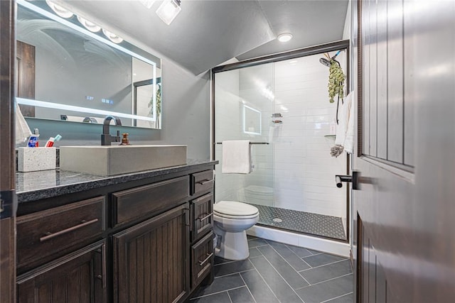 2063 County Road 1336, Blanchard, OK 73010 - full bathroom featuring vanity, tile patterned floors, a shower stall, and vaulted ceiling