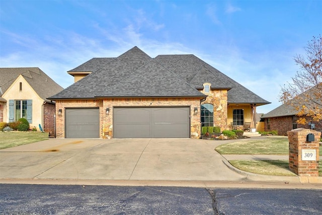 french country home with a garage