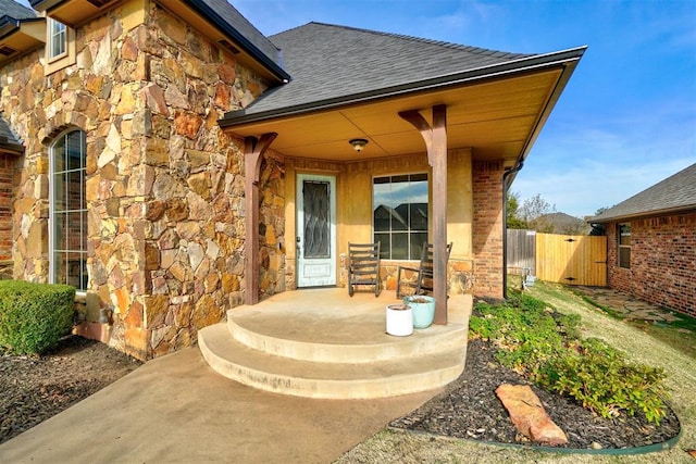 property entrance featuring covered porch