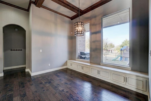 empty room with dark wood-type flooring, an inviting chandelier, and beam ceiling