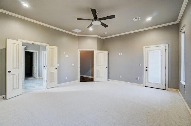 unfurnished bedroom featuring ceiling fan, light carpet, and ornamental molding