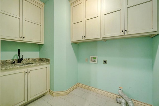 laundry room featuring cabinets, sink, hookup for a washing machine, and hookup for an electric dryer