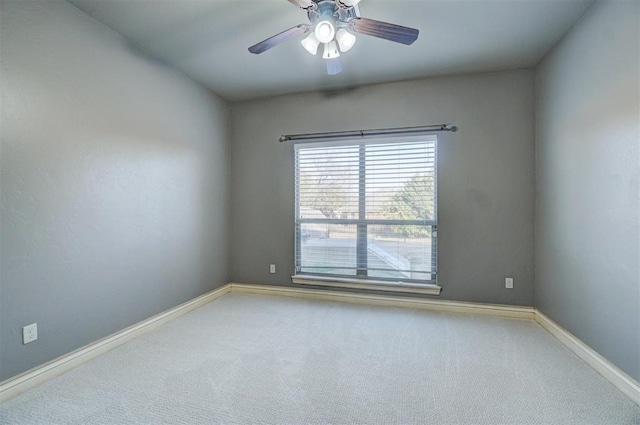 empty room with ceiling fan and carpet floors