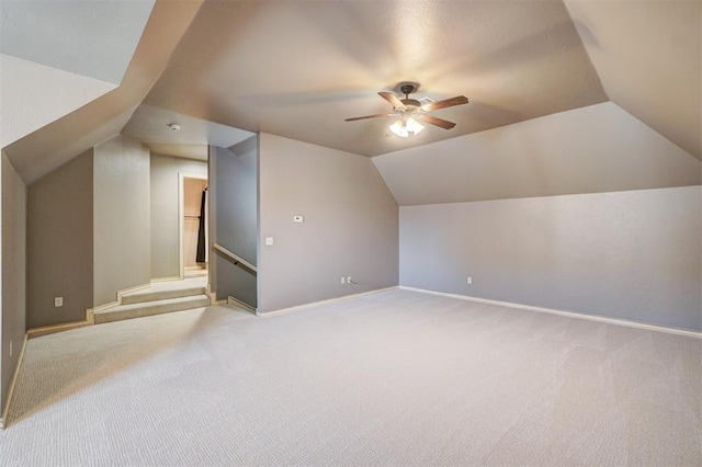 bonus room featuring vaulted ceiling, ceiling fan, and carpet