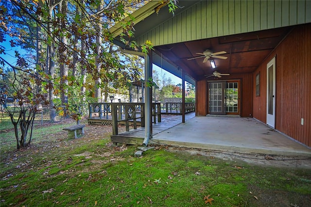 exterior space featuring ceiling fan and a deck