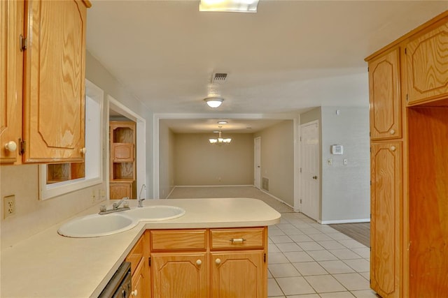 kitchen featuring dishwasher, kitchen peninsula, pendant lighting, a chandelier, and light tile patterned floors