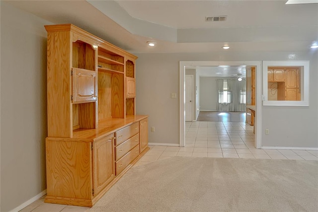 hallway with light tile patterned flooring and french doors