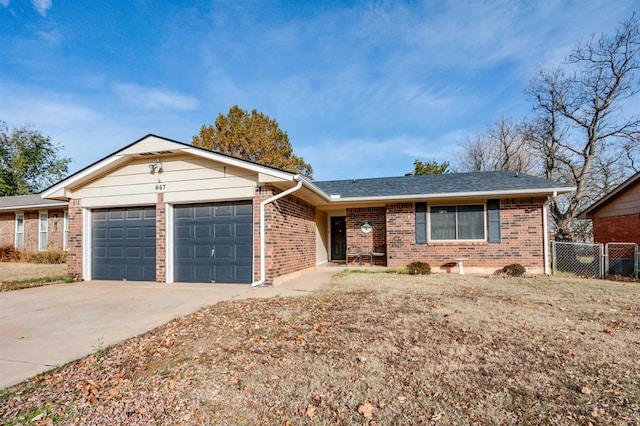 ranch-style house featuring a garage