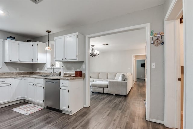 kitchen featuring sink, white cabinets, stainless steel dishwasher, and dark hardwood / wood-style floors