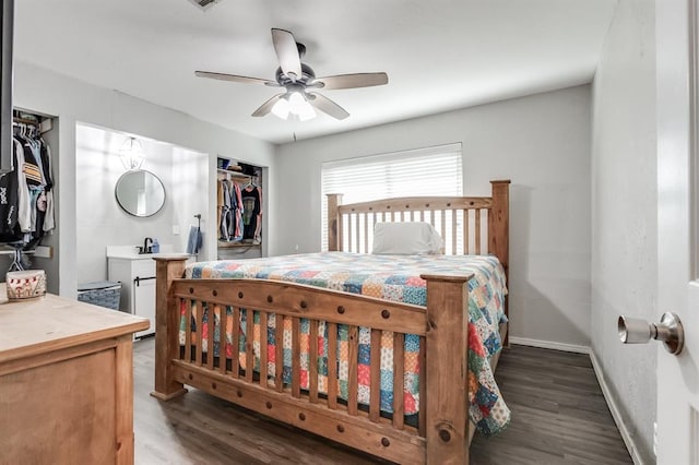 bedroom featuring dark hardwood / wood-style floors, ceiling fan, a walk in closet, and a closet