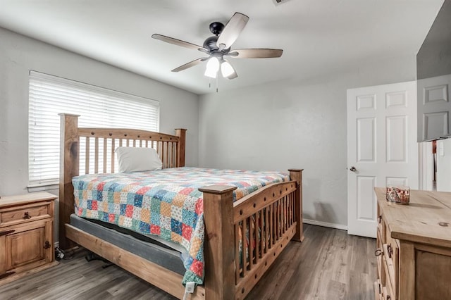 bedroom with hardwood / wood-style flooring and ceiling fan