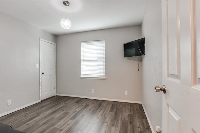 spare room featuring dark hardwood / wood-style flooring