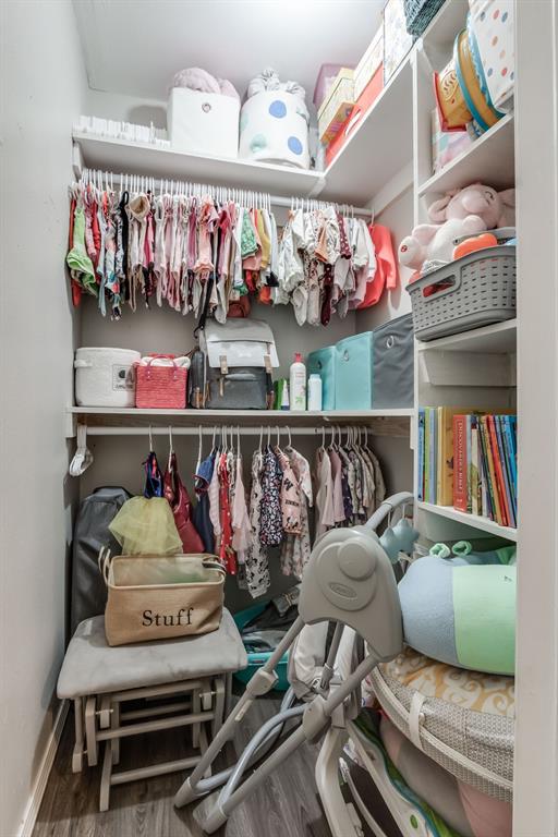 walk in closet featuring hardwood / wood-style floors