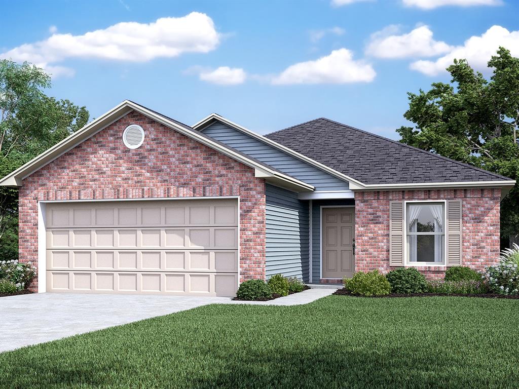 view of front of home with a garage and a front lawn