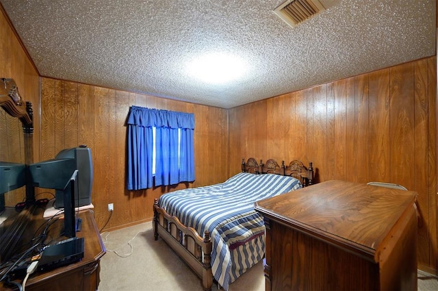 carpeted bedroom featuring wooden walls