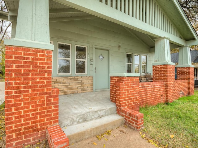 entrance to property featuring a porch