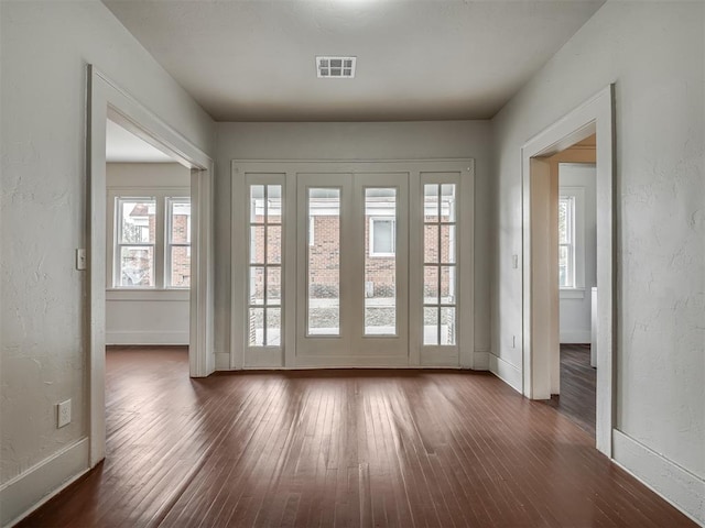 entryway with dark wood-type flooring