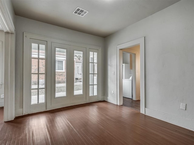 doorway to outside featuring dark wood-type flooring