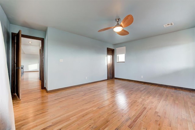 spare room featuring ceiling fan and light hardwood / wood-style floors