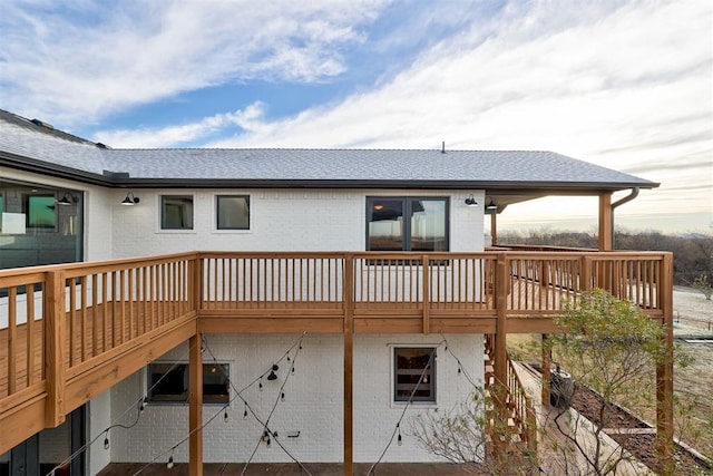 rear view of house featuring a deck