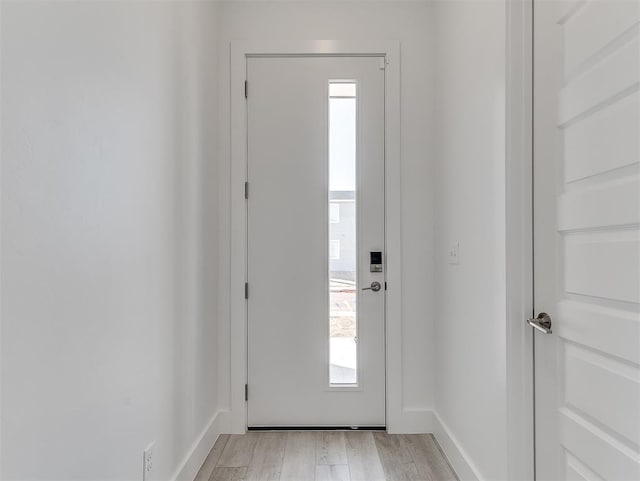 doorway to outside with light hardwood / wood-style flooring