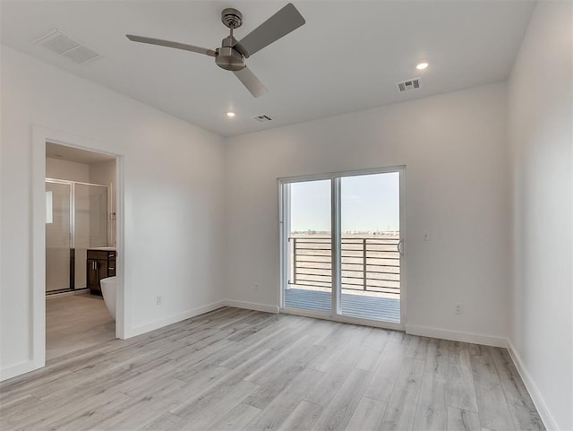 empty room featuring ceiling fan and light wood-type flooring