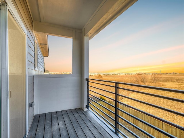 view of balcony at dusk