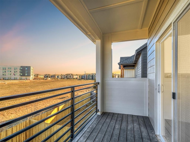 view of balcony at dusk