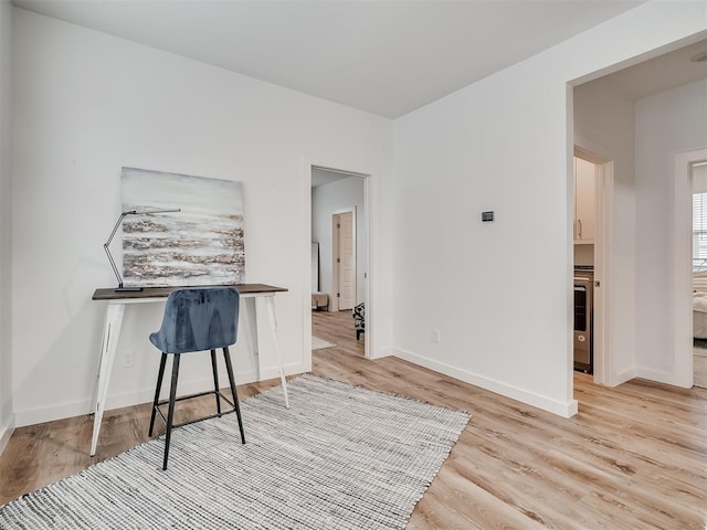 office space with light wood-type flooring