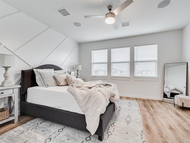 bedroom featuring ceiling fan and light hardwood / wood-style flooring