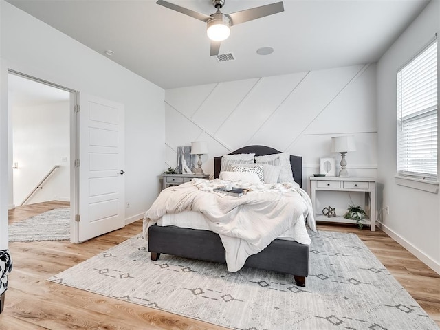 bedroom featuring light wood-type flooring and ceiling fan