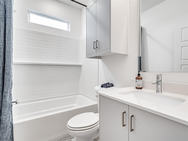 full bathroom with toilet, vanity, and tiled shower / bath combo