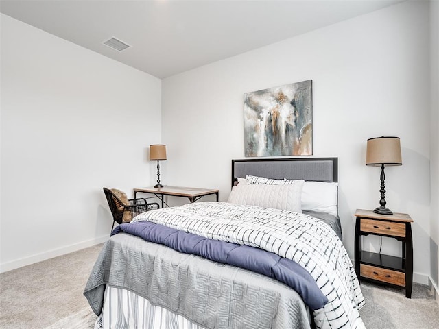 bedroom with light carpet