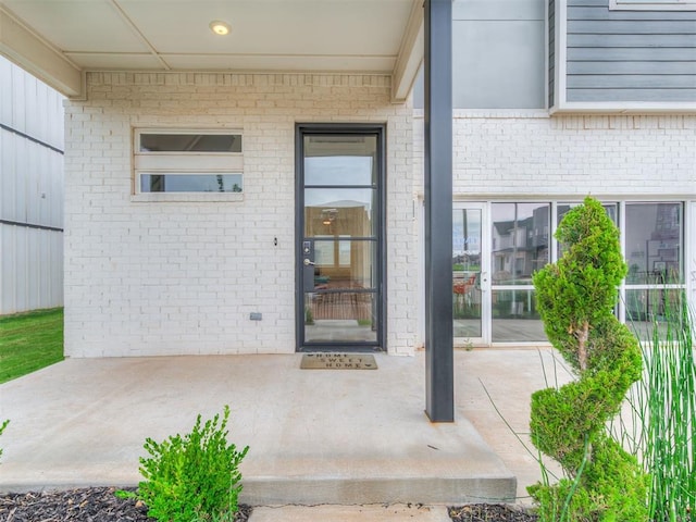 entrance to property with a patio area