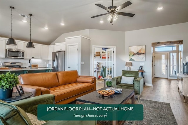 living room with french doors, vaulted ceiling, ceiling fan, sink, and light hardwood / wood-style floors