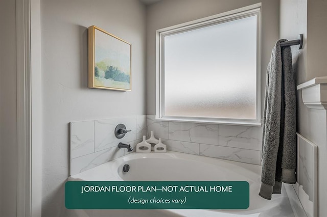 bathroom with a tub to relax in