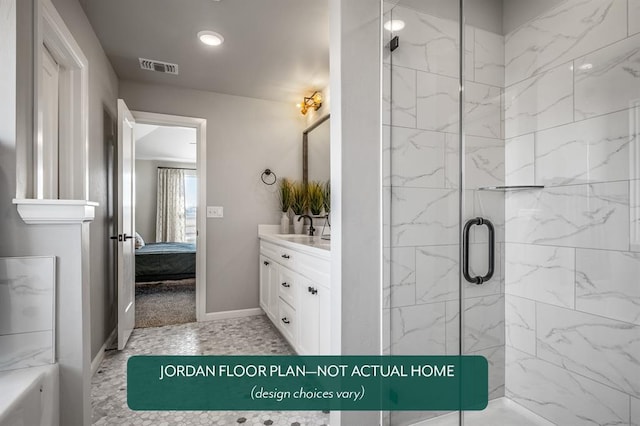 bathroom with vanity and a shower with door