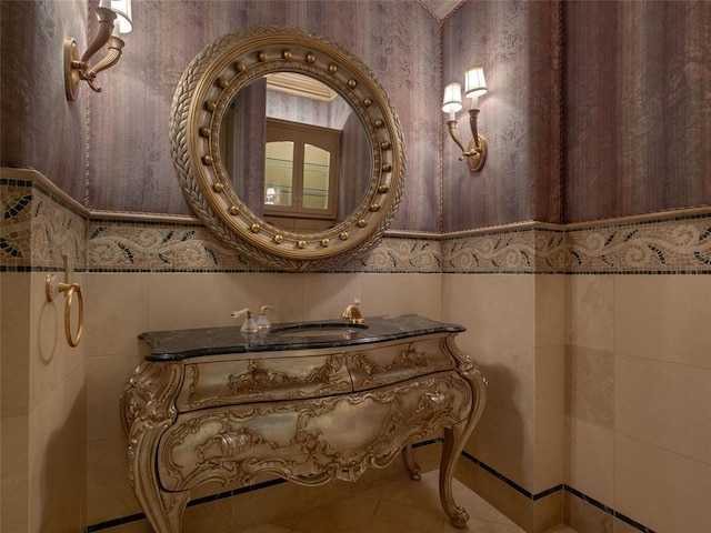 bathroom with tile patterned floors and tile walls