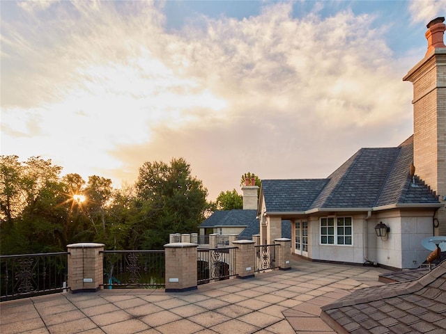 view of patio terrace at dusk