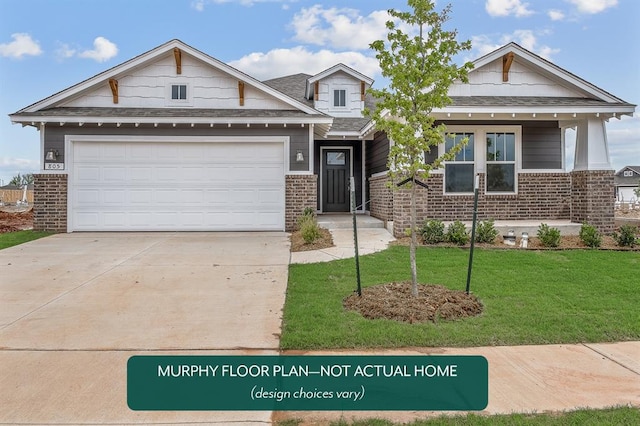 craftsman inspired home with a garage and a front lawn