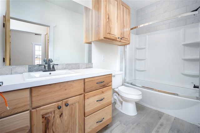 full bathroom featuring toilet, vanity, shower / bathtub combination, and hardwood / wood-style flooring