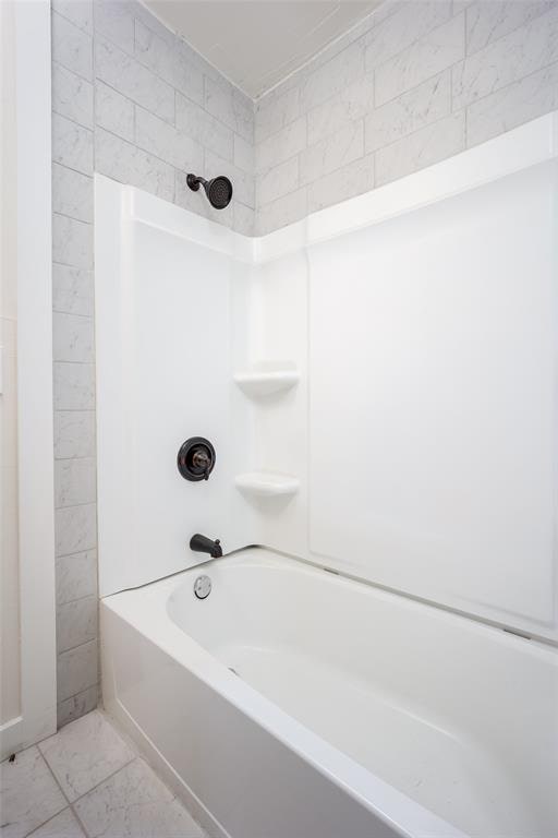 bathroom with shower / bath combination