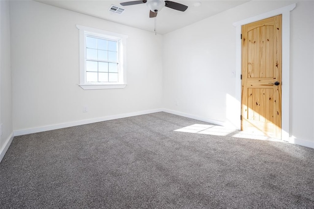 carpeted empty room featuring ceiling fan