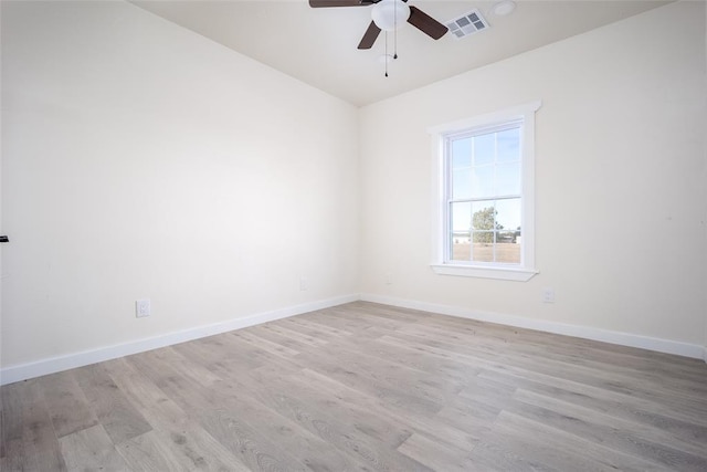 unfurnished room with light wood-type flooring and ceiling fan