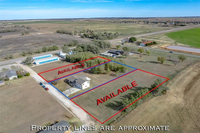 birds eye view of property featuring a rural view