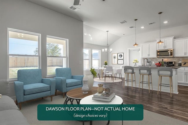 living room with ceiling fan with notable chandelier, sink, dark wood-type flooring, and vaulted ceiling