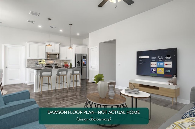 living room featuring ceiling fan and dark hardwood / wood-style flooring