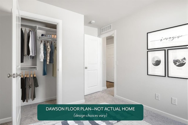 unfurnished bedroom featuring light colored carpet and a closet