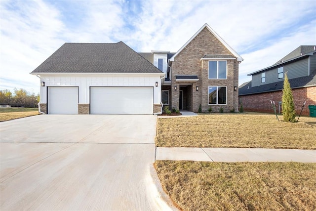 view of front of house with a front lawn and a garage